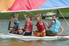 Camp Longhorn boy campers sailing on Inks Lake in Burnet, Texas